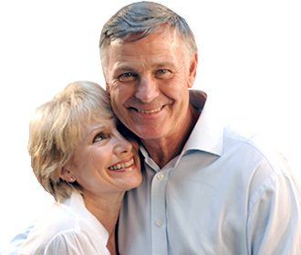 A middle-aged Caucasian couple embrace and smile