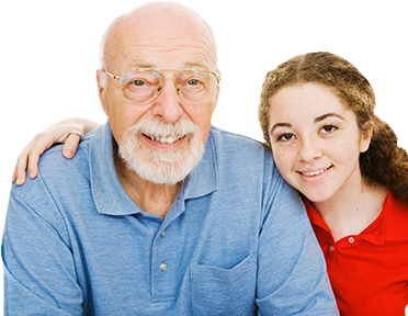 A grandfather sits with his granddaughter