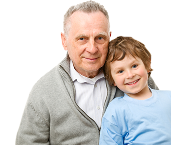 A grandfather sits with his grandson