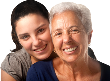 A young lady hugs her grandmother